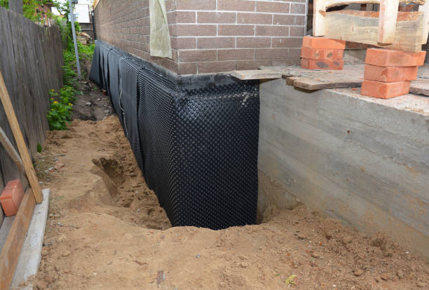 Happy homeowners after waterproofing job in Mauricetown